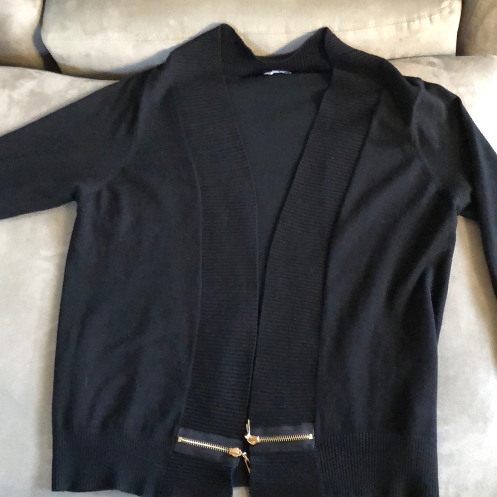 Black sweater with gold zipper accent